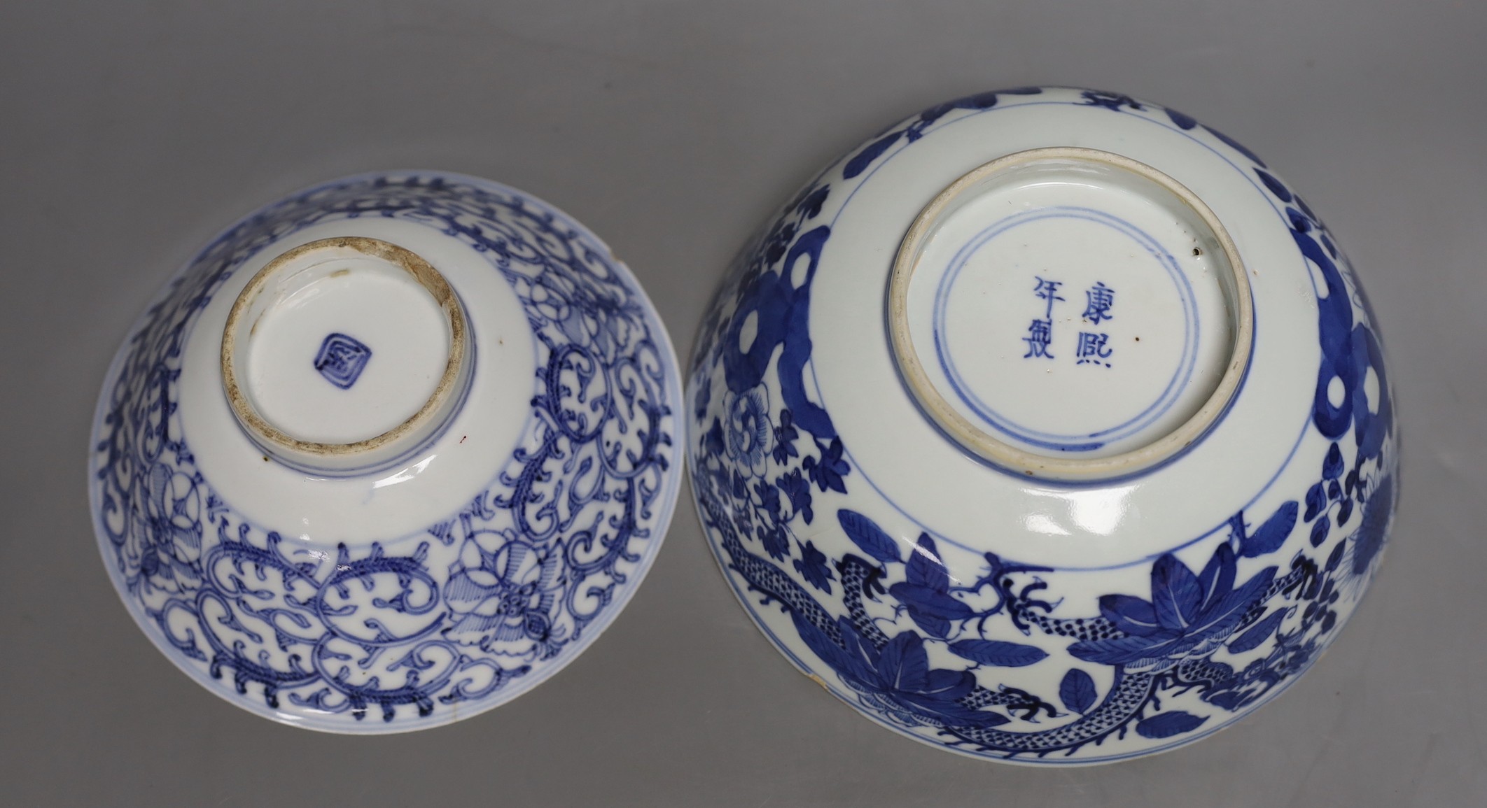 A Chinese blue and white dragon bowl, another blue and white bowl and a saucer, 19th century, largest 20.5cm